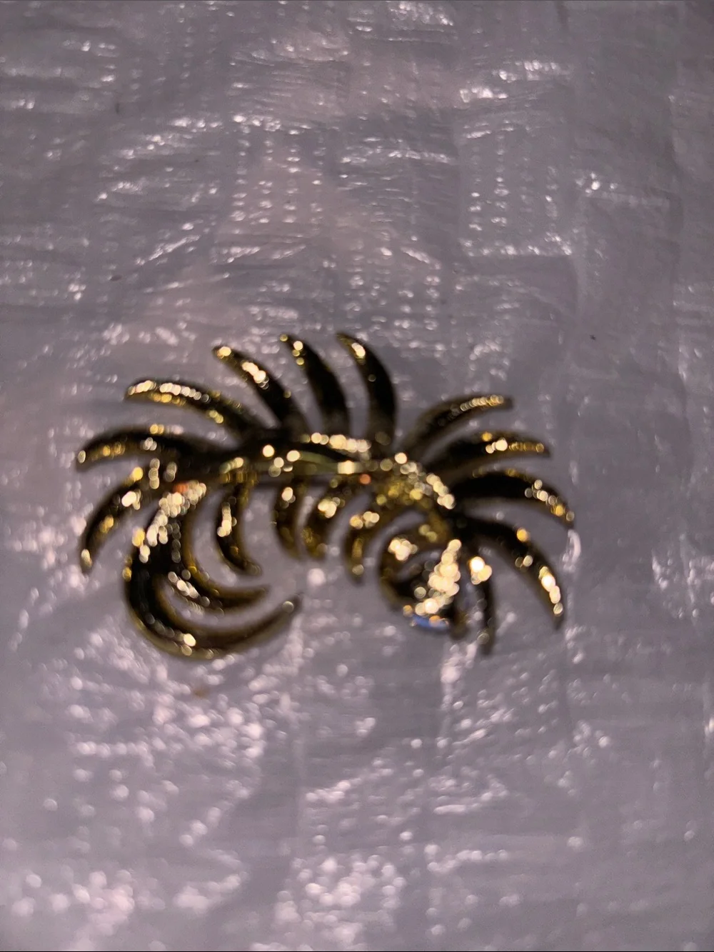 Gold Tone Floral Swirl Brooch with Iridescent Crystal